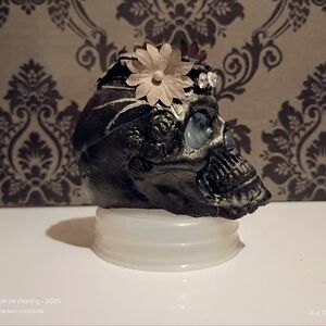 Decorative Black Skull with Floral Accents